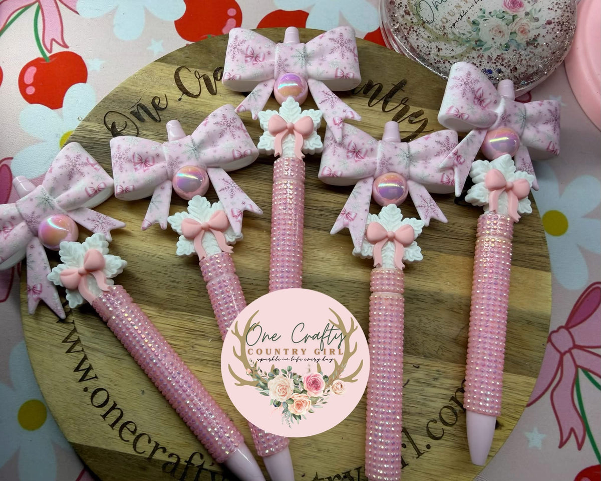 Pink bow and snowflake on rhinestone pen