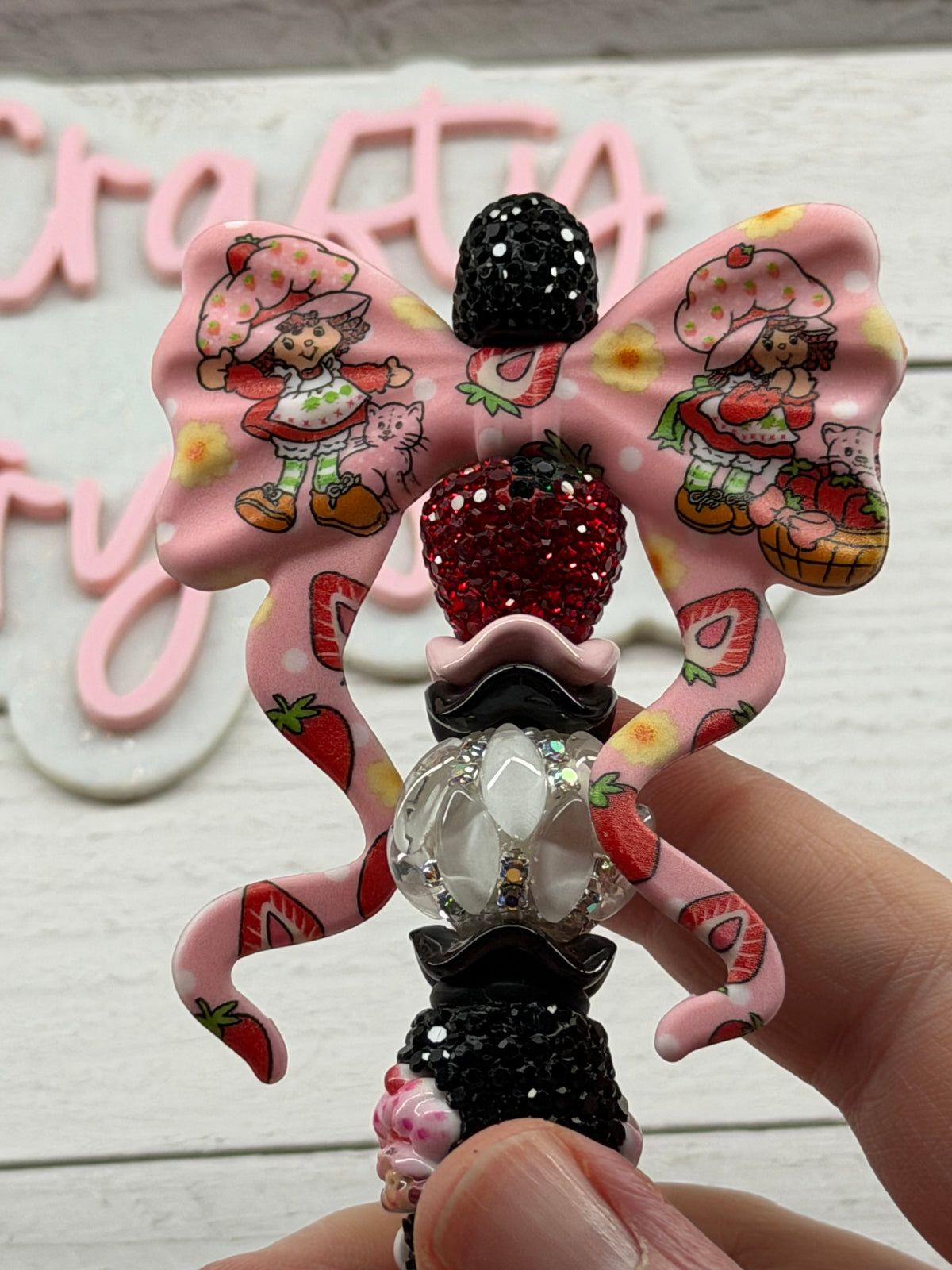 Strawberry Shortcake inspired bow on a strawberry shortcake rhinestone pen