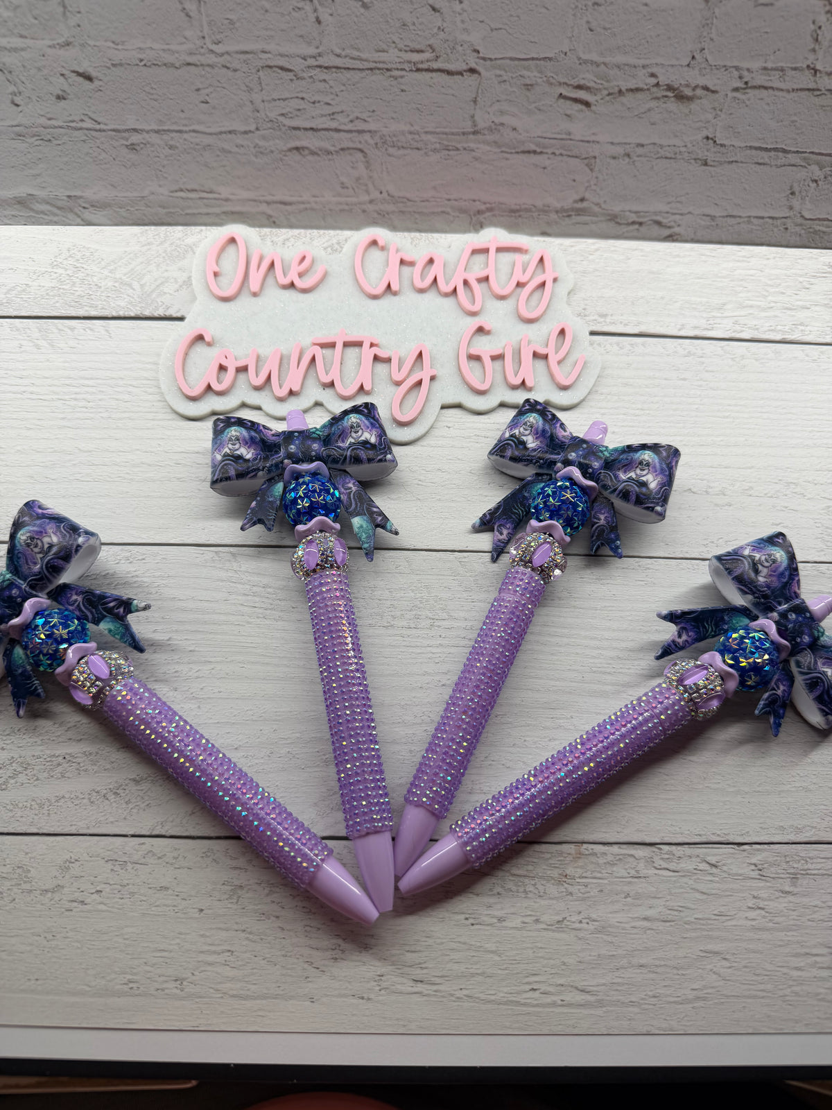 Sea Witch bow on light purple rhinestone plastic pen