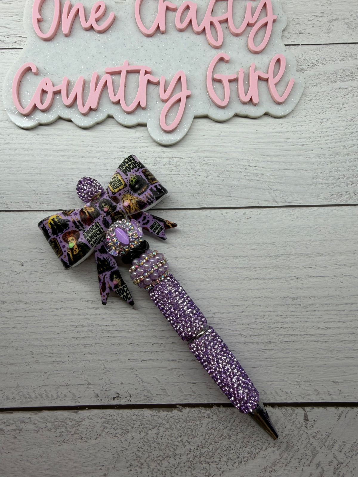 A muck a muck a muck purple hocus pocus inspired purple bow on a light purple rhinestone pen