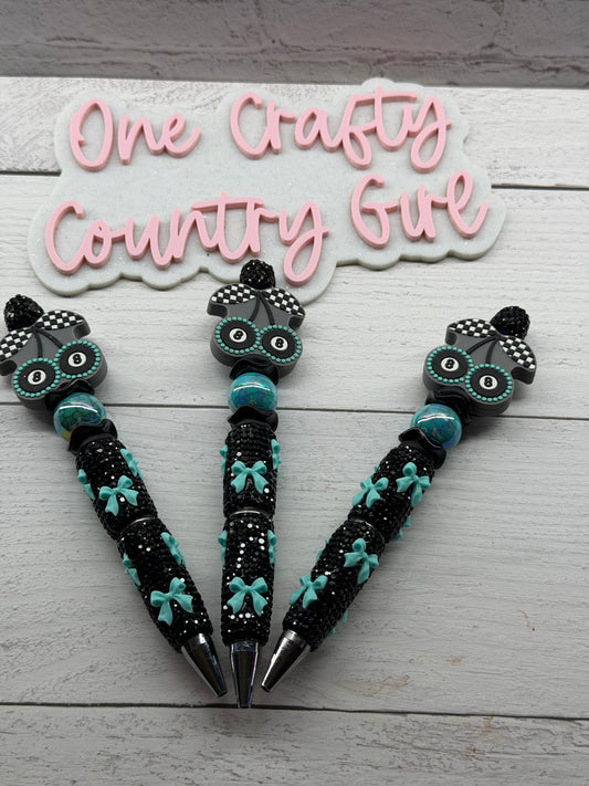Eight ball cherries on a turquoise bows on black rhinestones