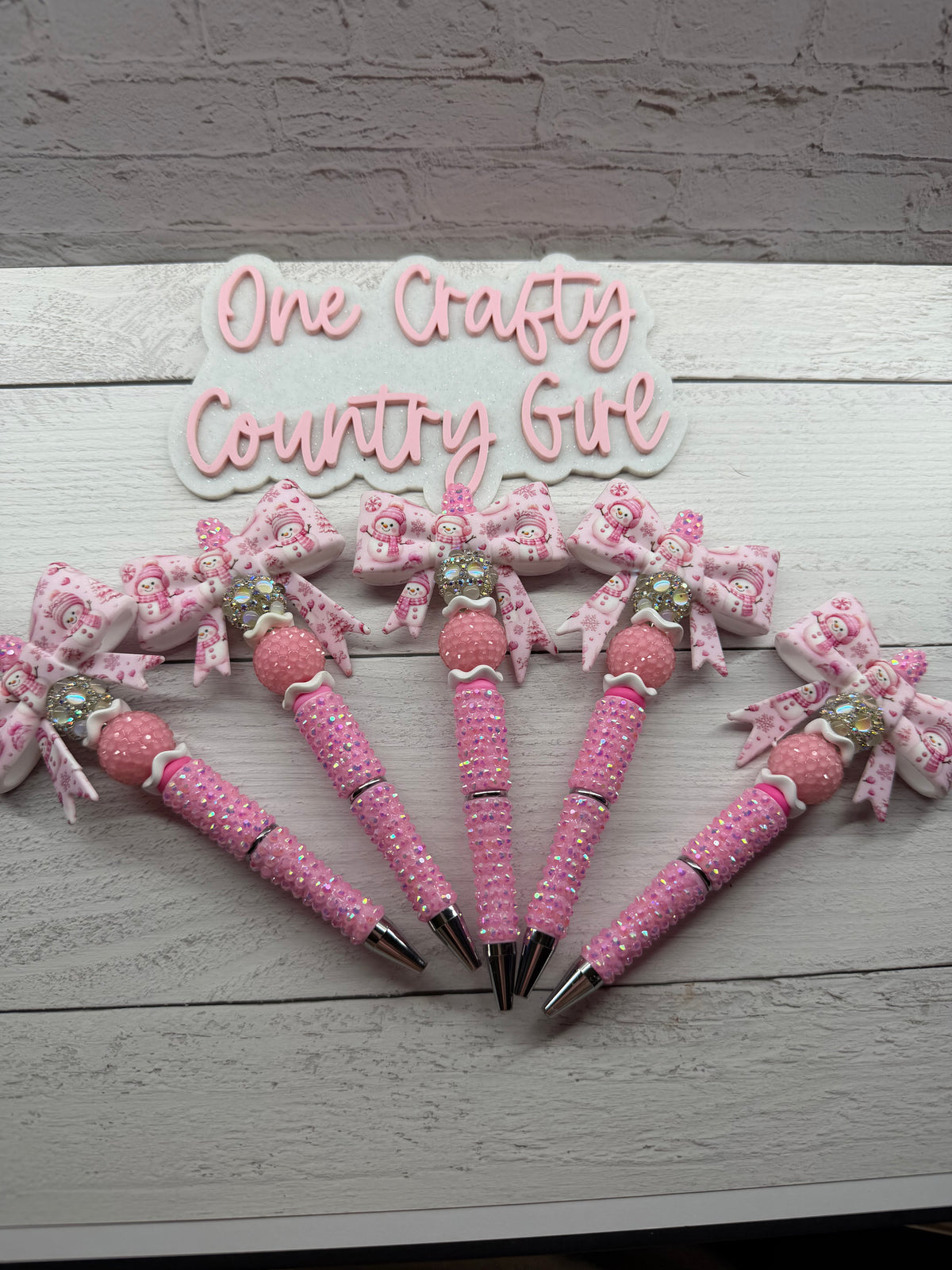 Pink snowman bow on light pink rhinestone pen