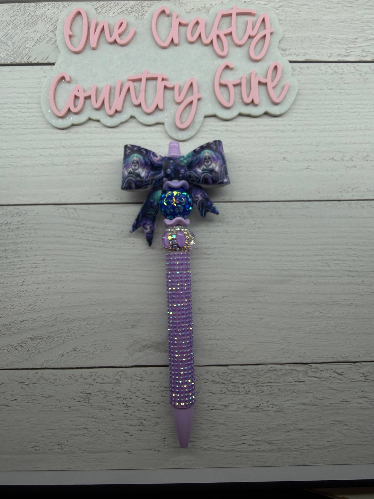 Sea witch bow on light purple plastic rhinestone pen