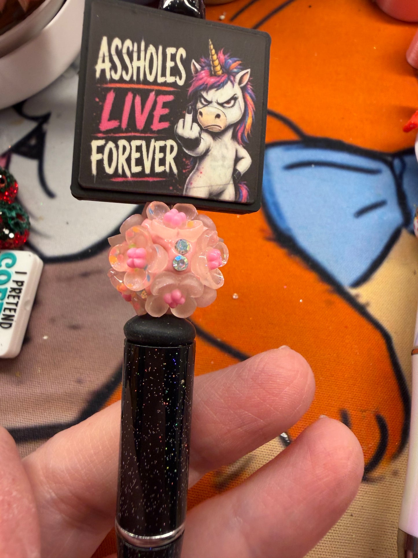 Assholes live forever on a glitter black pen