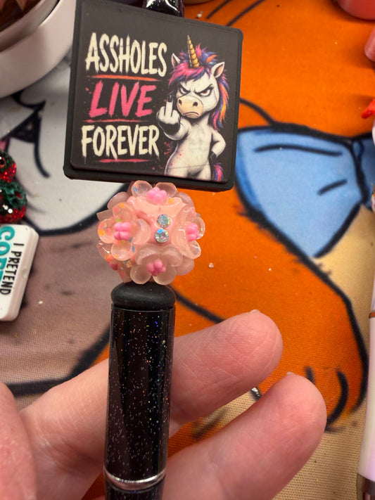 Assholes live forever on a glitter black pen