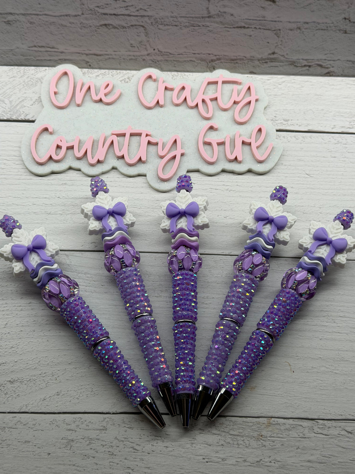 Lavender bow snowflake on a lavender rhinestone pen
