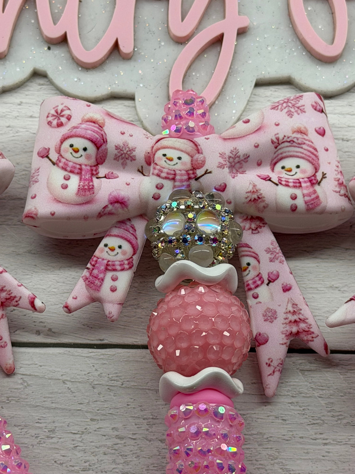 Pink snowman bow on light pink rhinestone pen