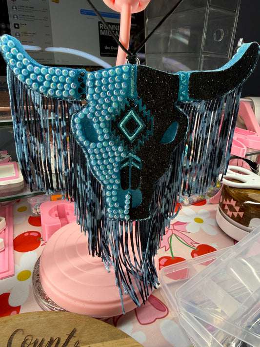 Blue/Black bull skull with fringe freshie in the scent of Troubadour.