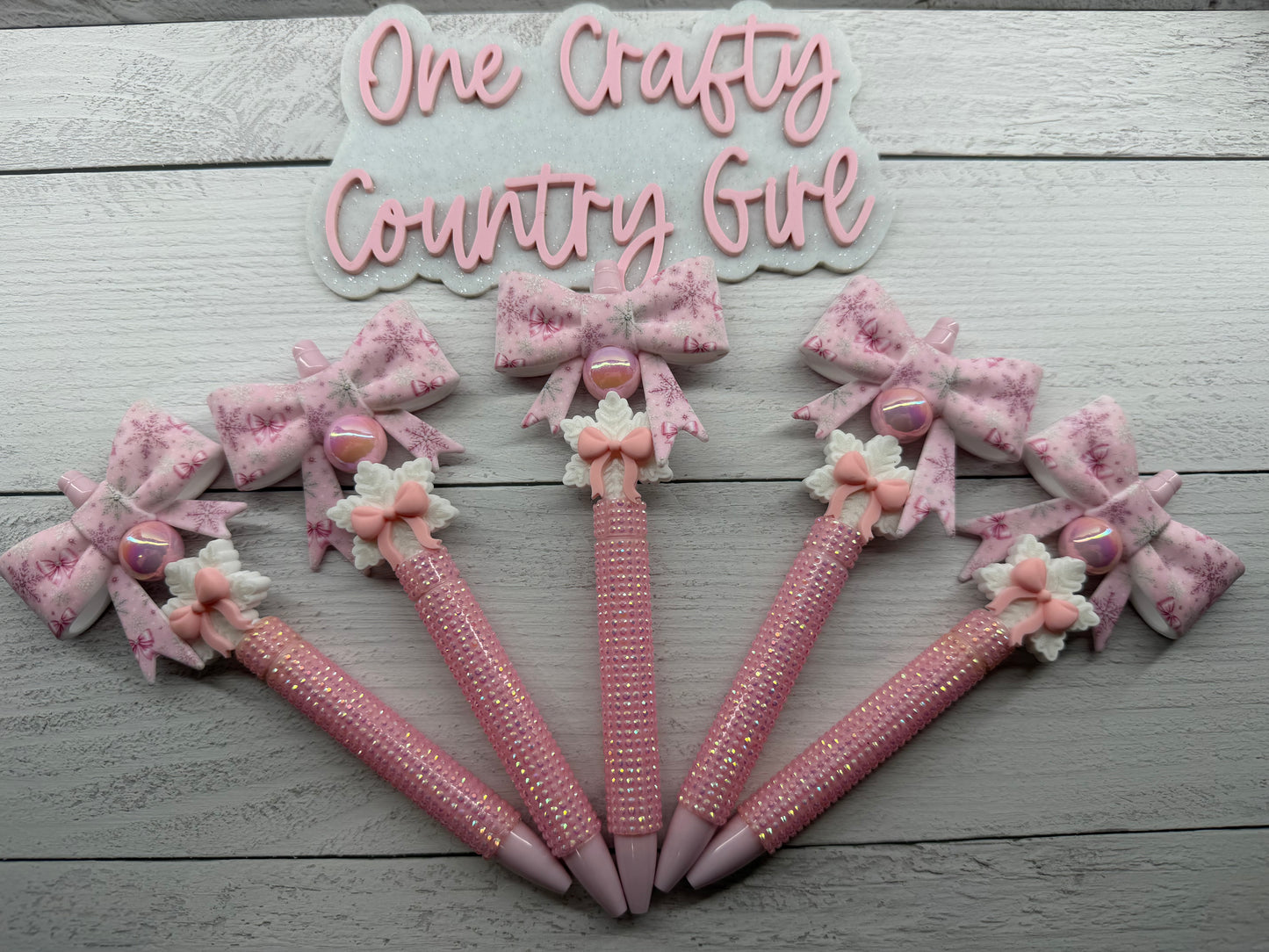 Pink bow and snowflake on rhinestone pen