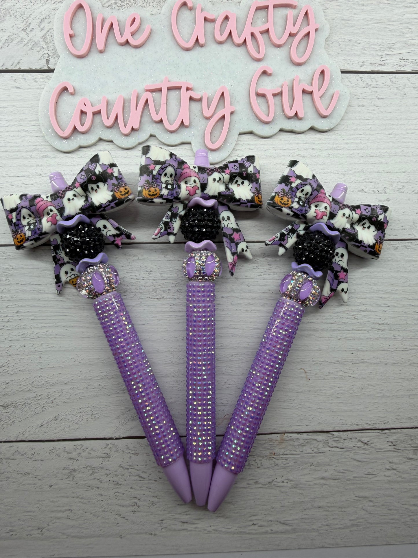 Ghost on a purple checkered bow on plastic rhinestone pen